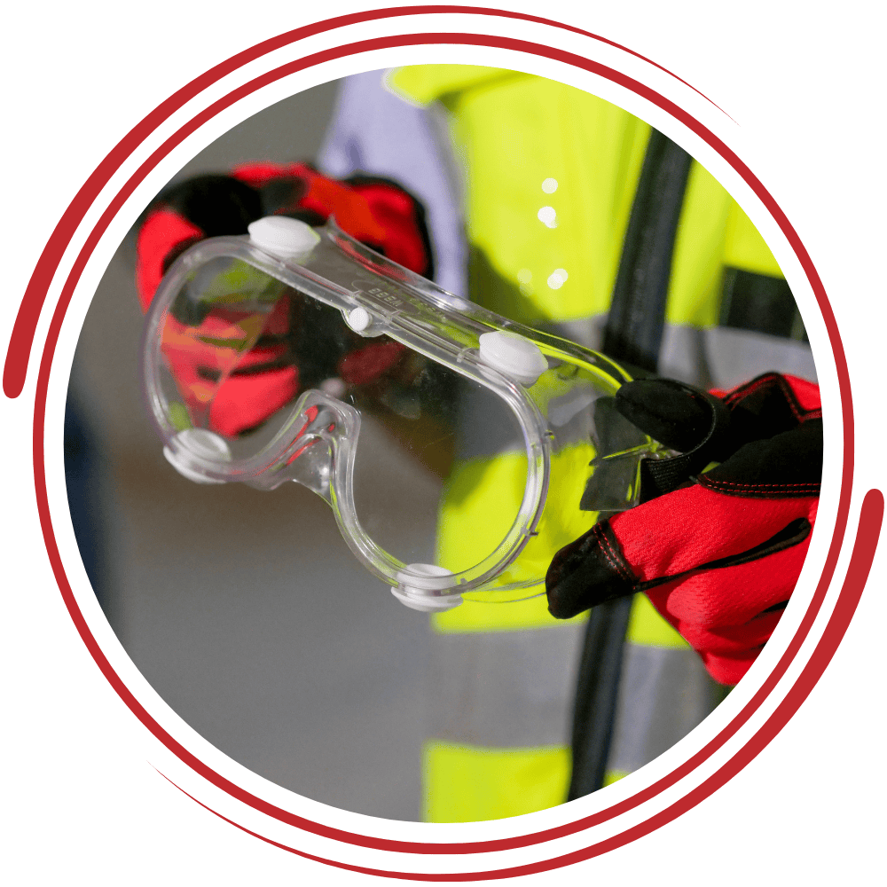 PPE safety goggles and high-visibility vest for workplace protection and safety standards.